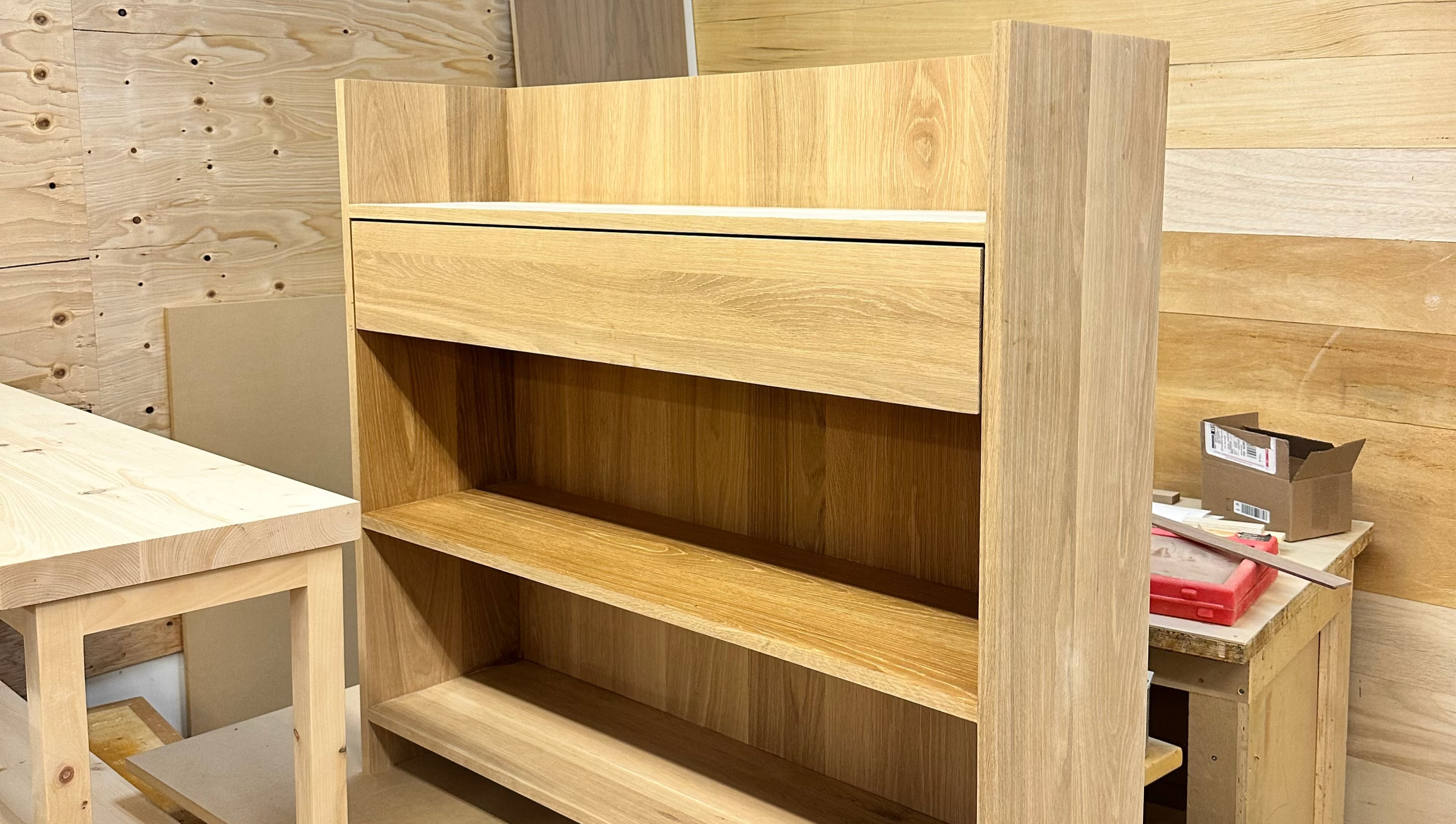 Wooden shelves and tables in a workshop setting