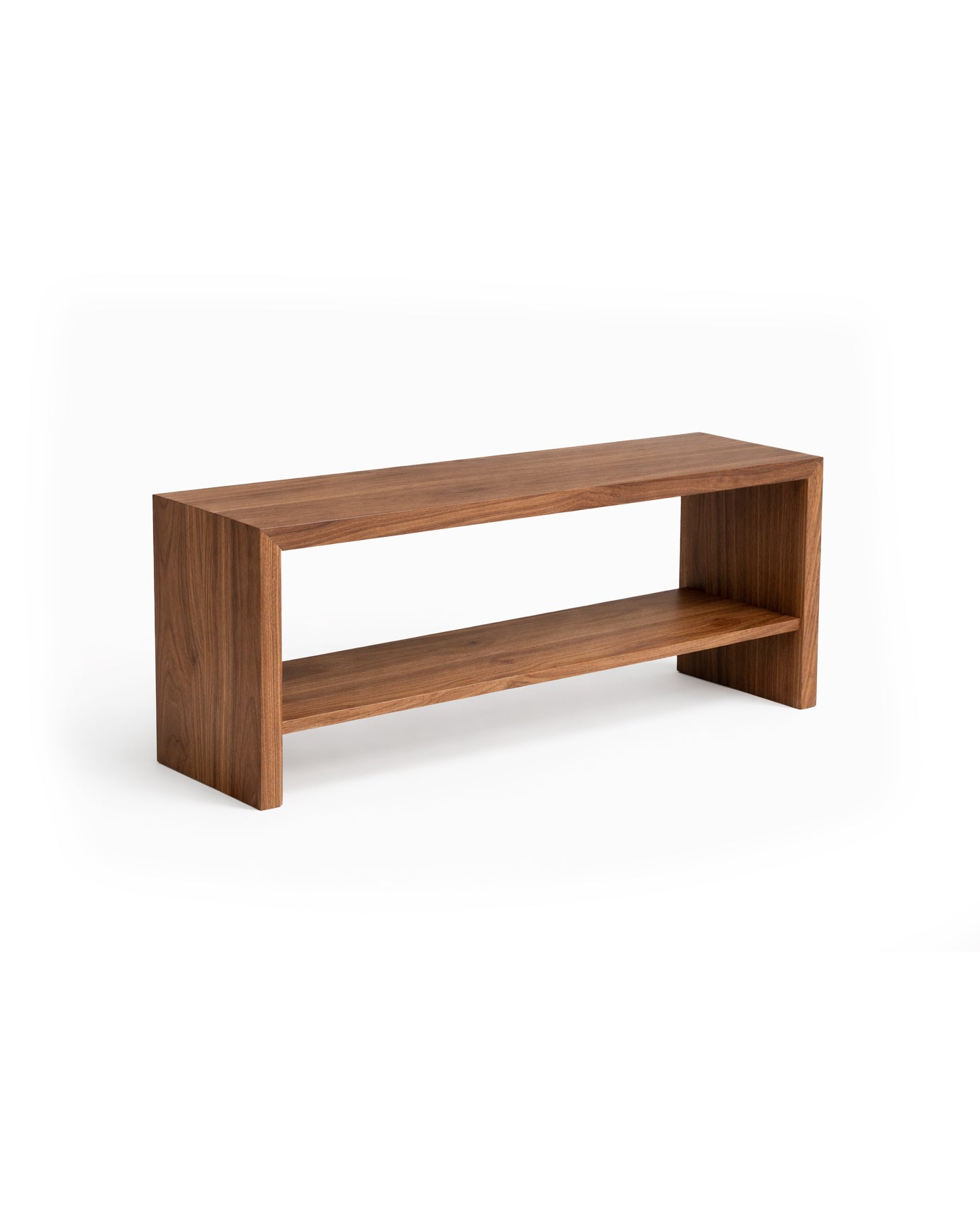 Wooden console table with a shelf on a white background